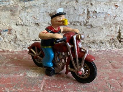 Popeye figure on motorcycle